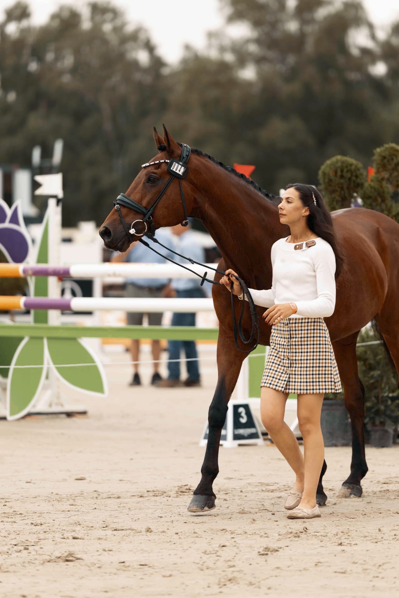 Grace Kay leading her horse at the trot-up