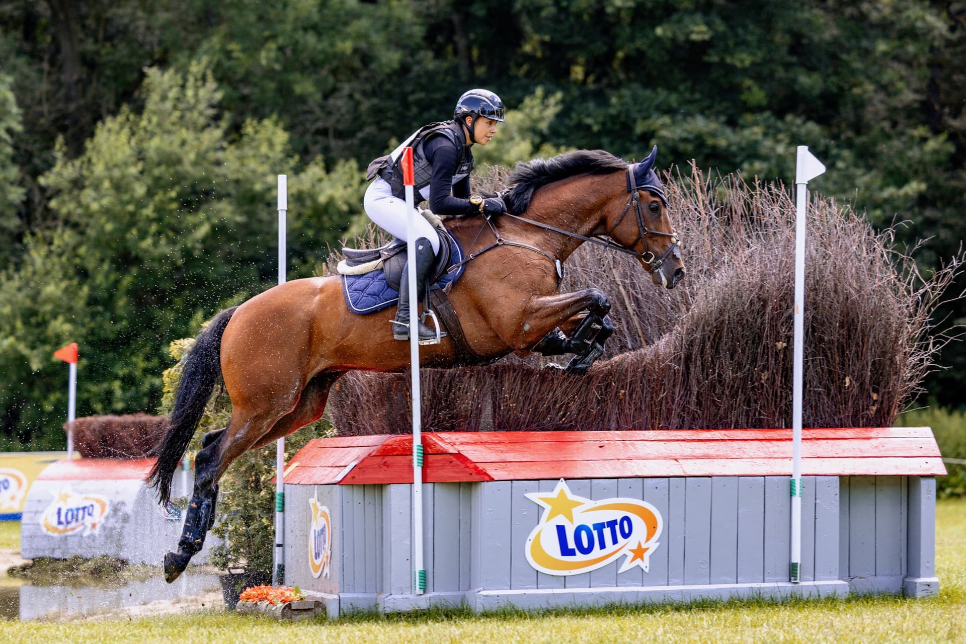 Grace Kay and her top horse jumping a cross-country fence