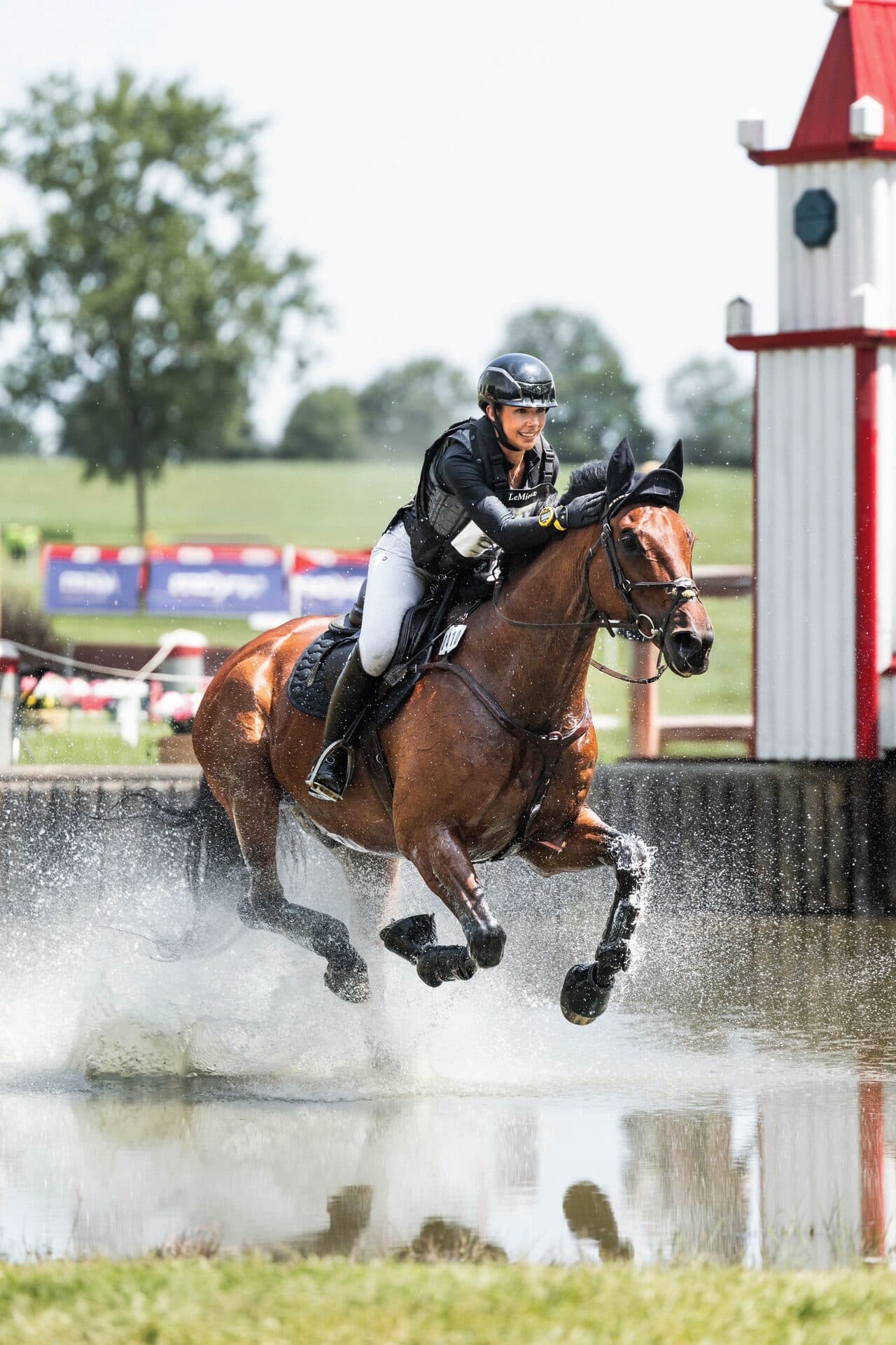 Grace Kay galloping through the water complex — branding placements